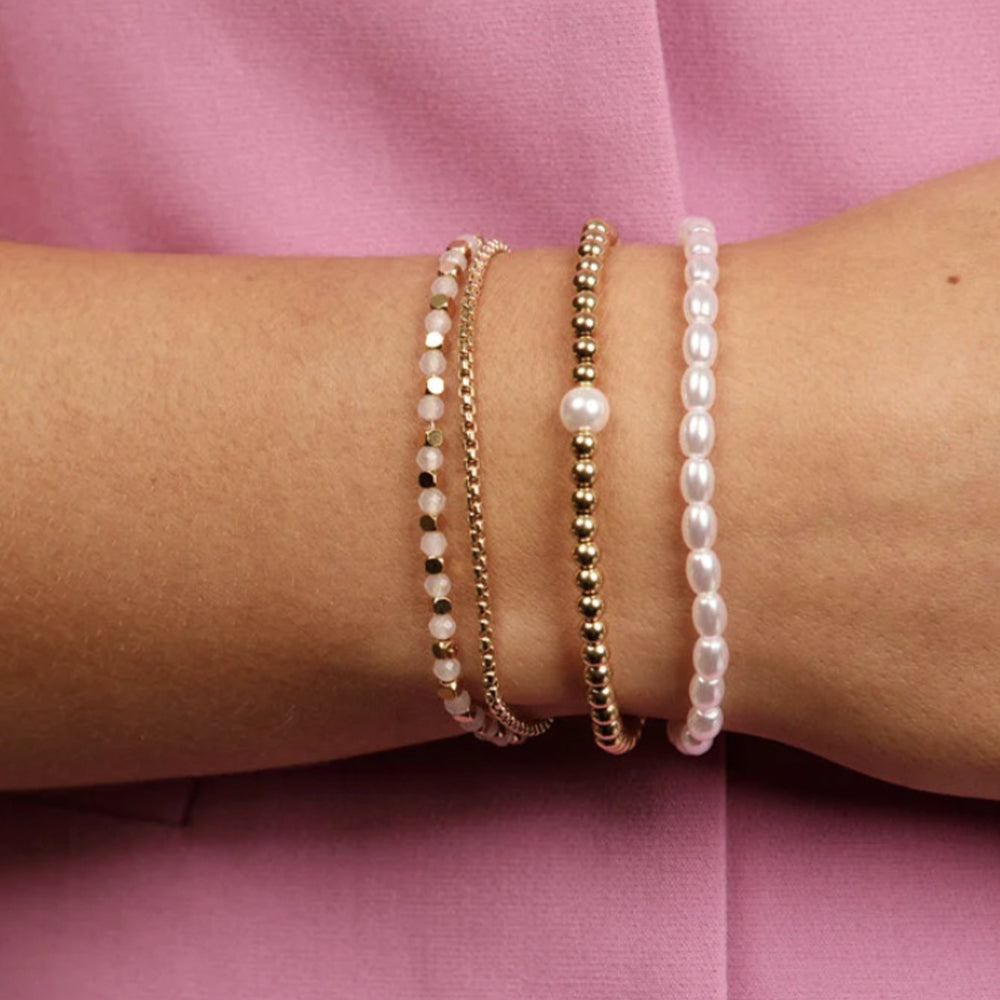 My Bendel - Gouden Armband Met Roze Glasstenen