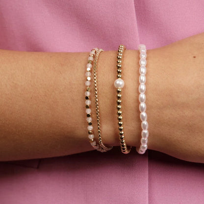 My Bendel - Gouden Armband Met Roze Glasstenen